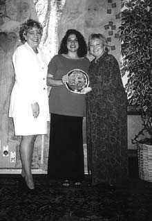 Frances Scarantino, an honoree of the Eckerd Salute to Woman Program, (c.) holds award with Eckerd representatives, Mona Furlott (l.) and Mary Beth Fox (r.).